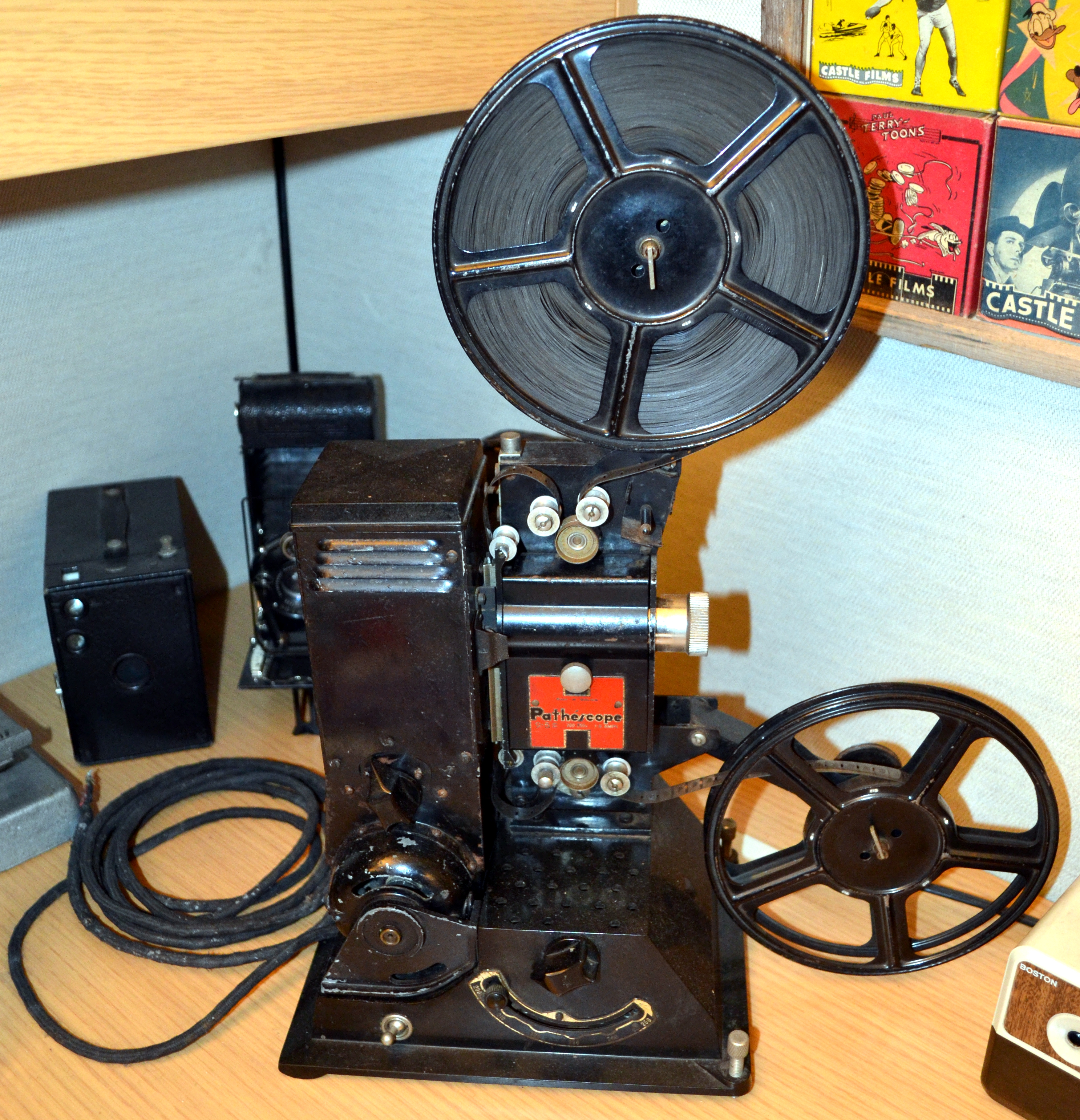 A 9.5mm Pathescope projector. The perforations are between each frame instead of running along the side.